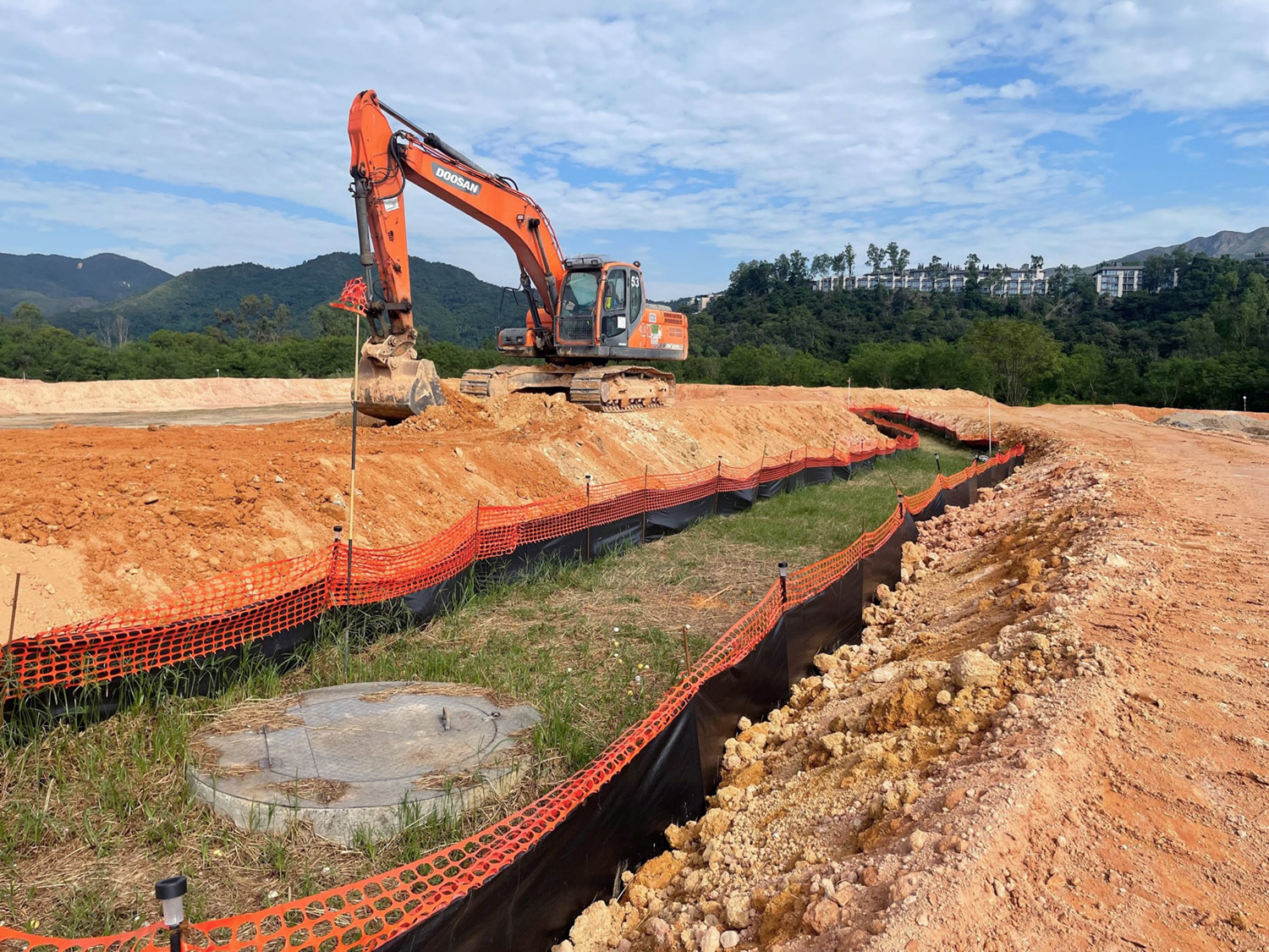 Stockpilling in progress with protection of gas well